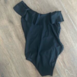 Women's bathing suit. One shoulder with ruffle around front & back. Size L